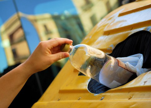 Recycling bins in a bustling London street